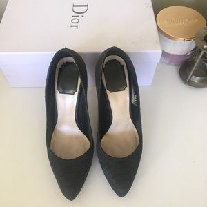 Dior black snakeskin print pumps.